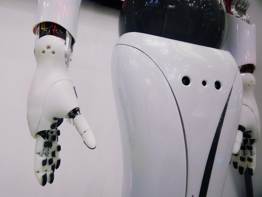 White humanoid robot in a modern lab environment