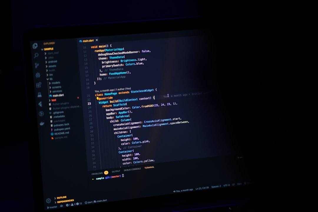 Close-up of colorful programming code on a dark monitor screen
